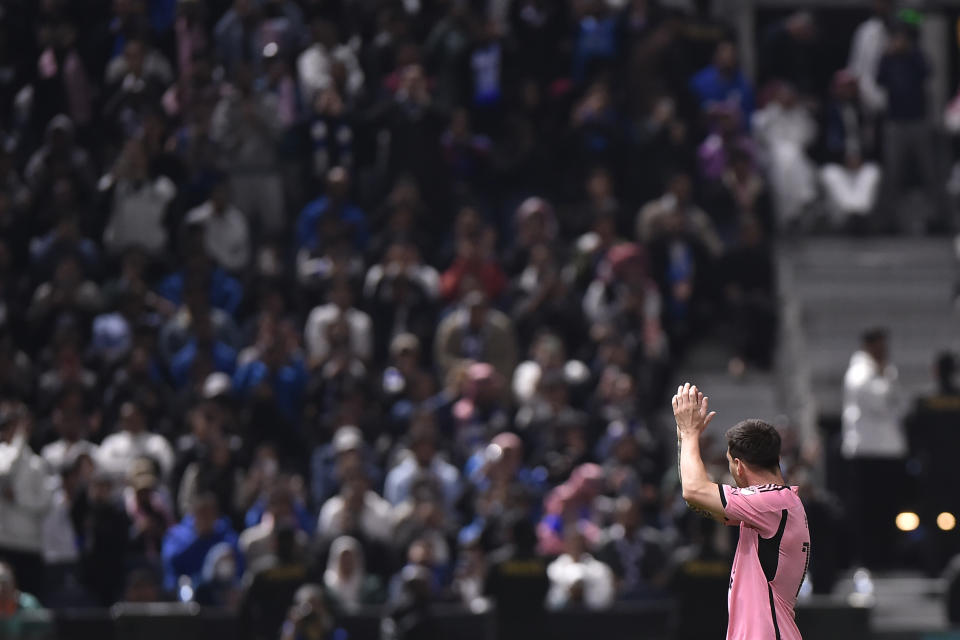 Inter Miami's Lionel Messi greets Saudi fans during the Riyadh Season Cup soccer match between Inter Miami and Al Hilal at Kingdom Arena Stadium in Riyadh, Saudi Arabia, Monday, Jan. 29, 2024. (AP Photo)