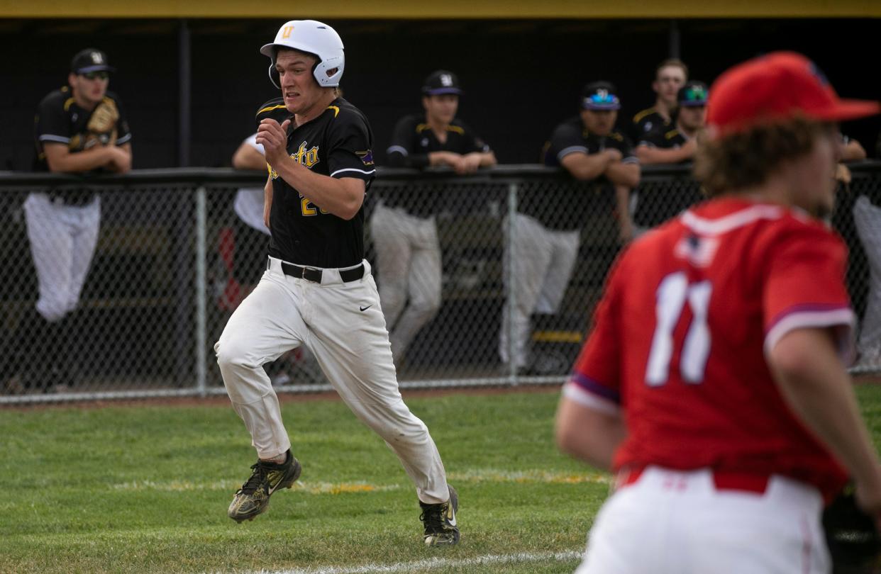 Unioto's Owen Link (26) runs into home scoring a run against Zane Trace in boys baseball at Unioto High School on April 26, 2024, in Chillicothe, Ohio. Unioto defeated Zane Trace 4-1.