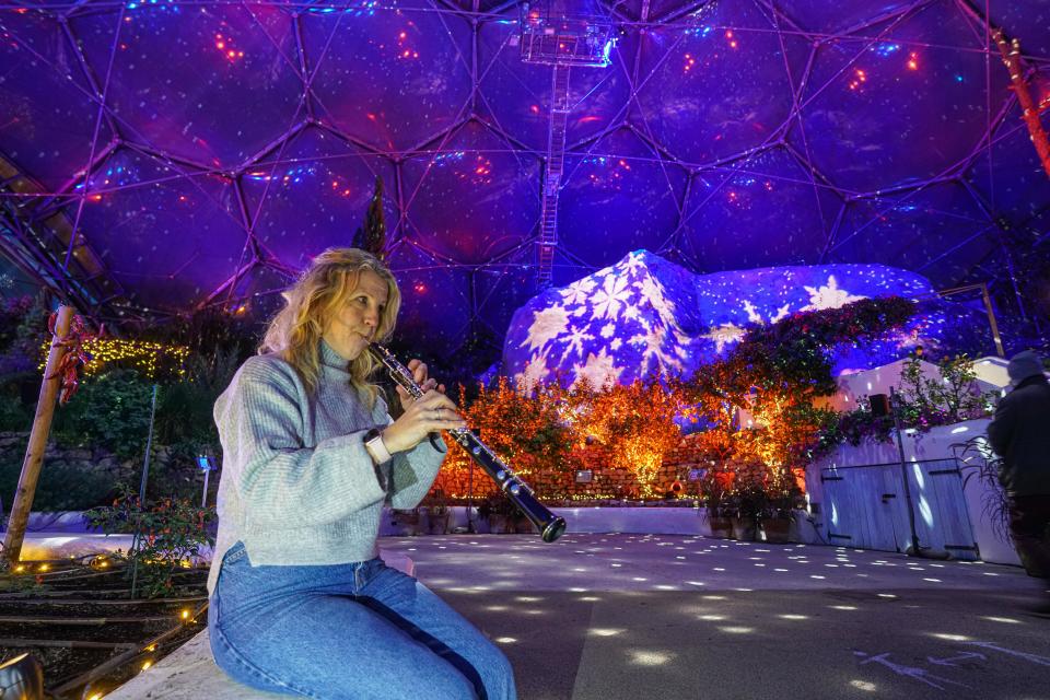 ST AUSTELL, ENGLAND - DECEMBER 03: Musician Tamsin Robinson rehearses for a live performance of festive music under the Christmas lights installation in the Mediterranean biome at the Eden Project on December 3, 2020 in St Austell, England. (Photo by Hugh Hastings/Getty Images)