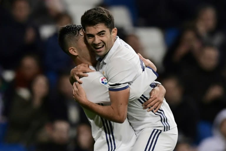 Real Madrid's French midfielder Enzo Zidane Fernandez (R) and Real Madrid's forward Mariano celebrate after scoring a goal against Cultural y Deportiva Leonesa at Santiago Bernabeu stadium in Madrid on November 30, 2016