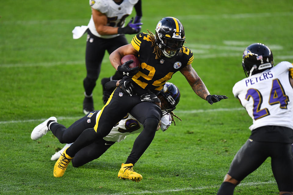 PITTSBURGH, PA - DECEMBER 02:  Benny Snell #24 of the Pittsburgh Steelers is dragged down by Tramon Williams #29 of the Baltimore Ravens during the fourth quarter at Heinz Field on December 1, 2020 in Pittsburgh, Pennsylvania. (Photo by Joe Sargent/Getty Images)