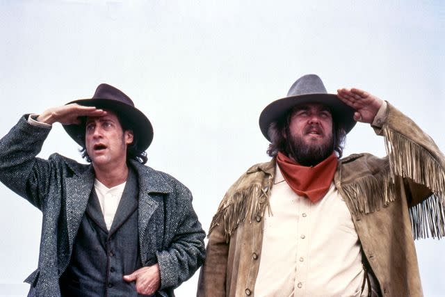 <p>TriStar/courtesy Everett Collection</p> Richard Lewis and John Candy in 'Wagons East!'