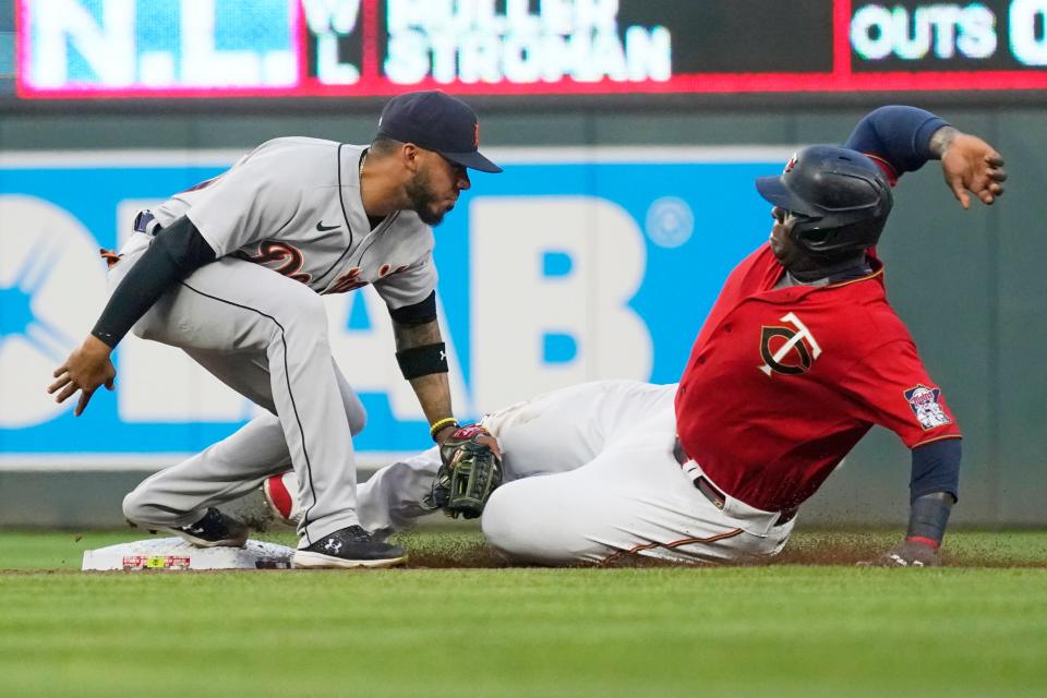 Detroit Tigers shortstop Harold Castro, left, tags out Minnesota Twins' Miguel Sano on a steal-attempt in the fourth inning of a baseball game, Monday, July 26, 2021, in Minneapolis.