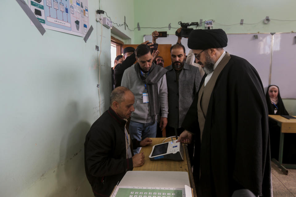 Iraqis vote during provincial elections in Najaf, Iraq, Monday, Dec. 18, 2023. (AP Photo/Anmar Khalil)