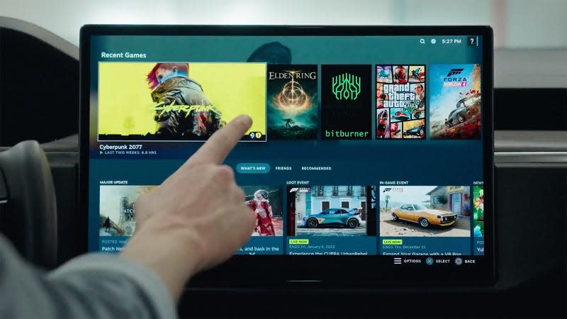 A person scrolls through Steam on a Tesla infotainment display.