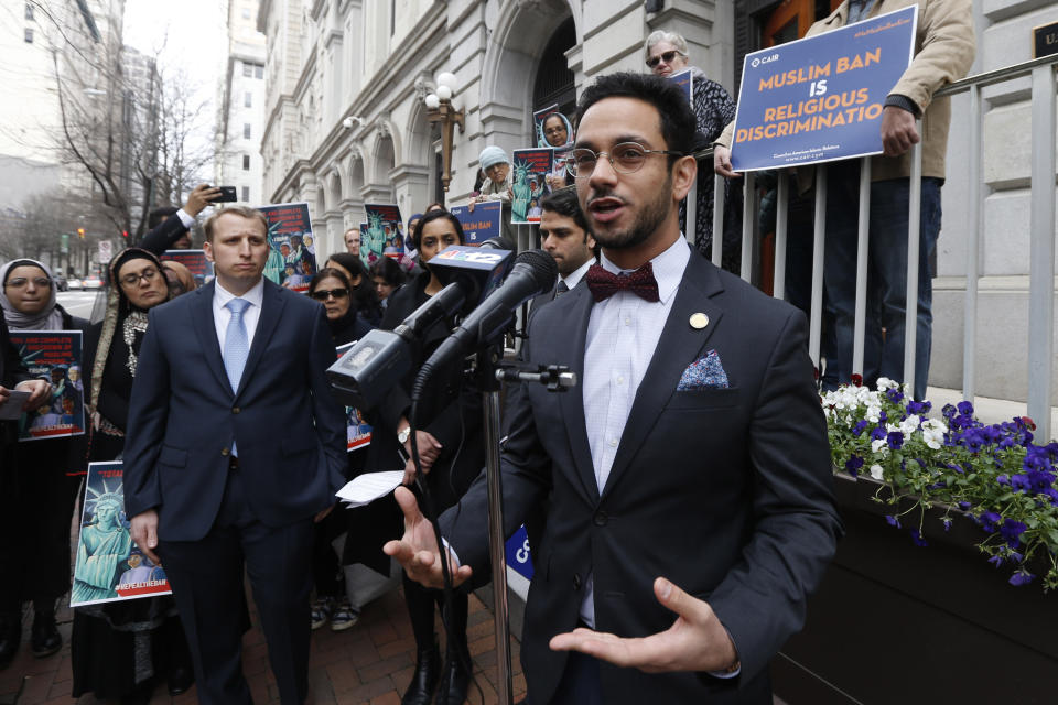 Del. Ibraheem Samirah, D-Fairfax, right, speaks during a rally outside the U.S. 4th Circuit Court of Appeals Tuesday Jan 28, 2020, in Richmond, Va. President Donald Trump's travel ban on travelers from predominantly Muslim countries is going back before a federal appeals court. On Tuesday, the 4th U.S. Circuit Court of Appeals in Richmond will hear arguments in three lawsuits filed by U.S. citizens and permanent residents whose relatives have been unable to enter the U.S. because of the ban. (AP Photo/Steve Helber)