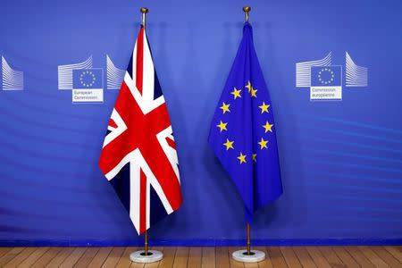 The British flag is seen next to the EU flag before Britain's Prime Minister Theresa May's arrival, at the European Commission headquarters in Brussels, Belgium November 24, 2018. REUTERS/Yves Herman