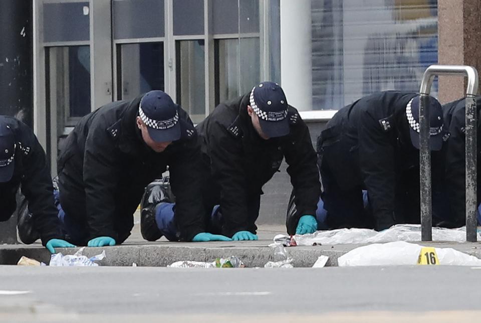 Police officers conducting a finger-tip search at the scene following the terror attack in Streatham (Aaron Chown/PA) (PA Wire)