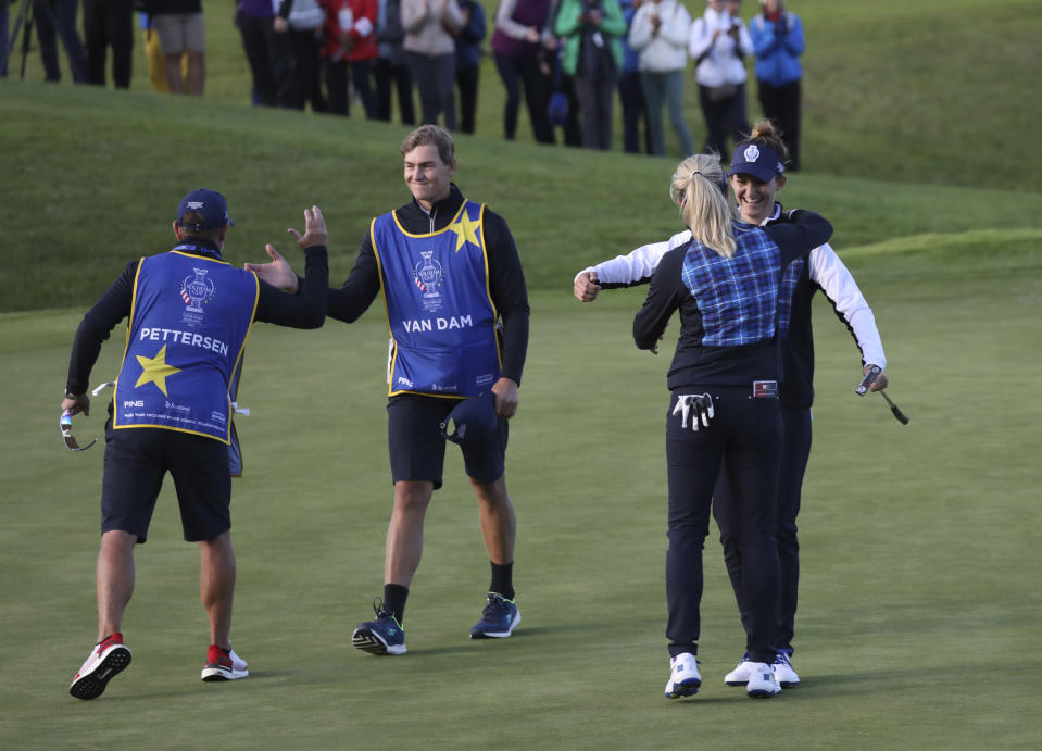 Suzann Pettersen and Anne Van Dam, right, celebrate after their victory against the US during the Fourballs match in the Solheim cup at Gleneagles, Auchterarder, Scotland, Friday, Sept. 13, 2019. (AP Photo/Peter Morrison)