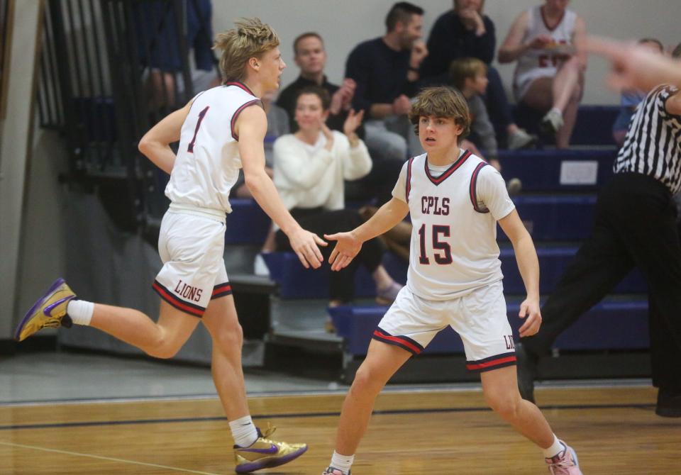 Cair Paravel's Simon Everhart and Lucas Marichal celebrate against Maranatha Christian Academy on Wednesday, Feb. 7. Cair Paravel defeated Maranatha Academy 66-49.