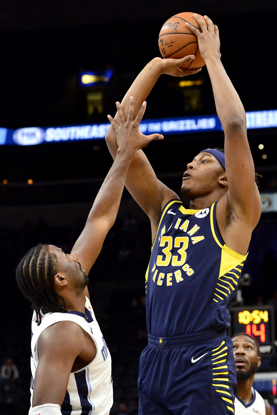 Indiana Pacers center Myles Turner (33) shoots against Memphis Grizzlies forward Solomon Hill, left, in the first half of an NBA basketball game Monday, Dec. 2, 2019, in Memphis, Tenn. (AP Photo/Brandon Dill)