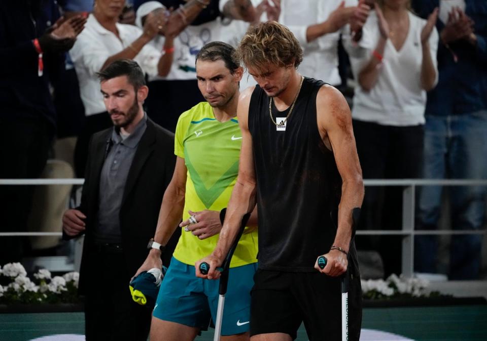 Zverev bravely came back on to court on crutches alongside Rafael Nadal to confirm he could not carry on (Christophe Ena/AP) (AP)