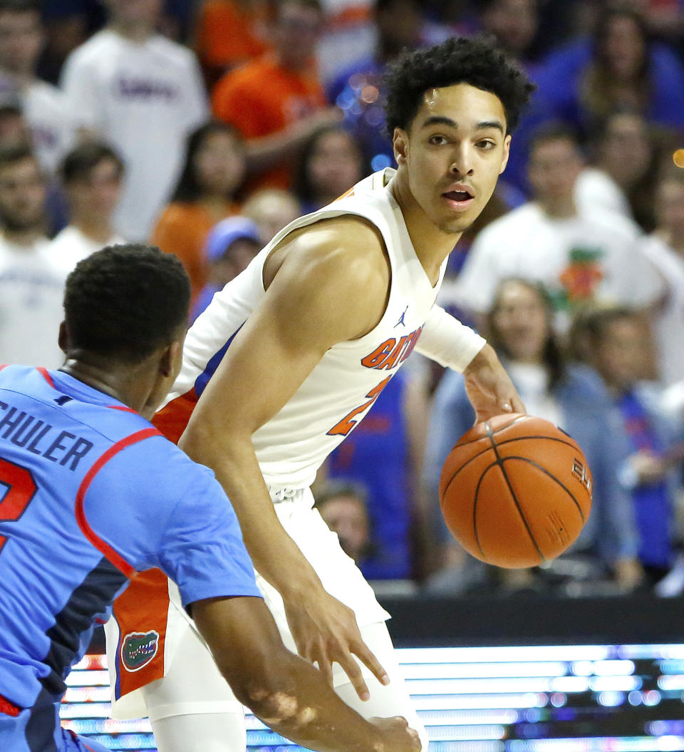 Florida guard Andrew Nembhard (2) looks to drive the ball into the paint as Mississippi's Devontae Shuler defends during an NCAA college basketball game Tuesday, Jan. 14, 2020, in Gainesville, Fla. (Brad McClenny/The Gainesville Sun via AP)