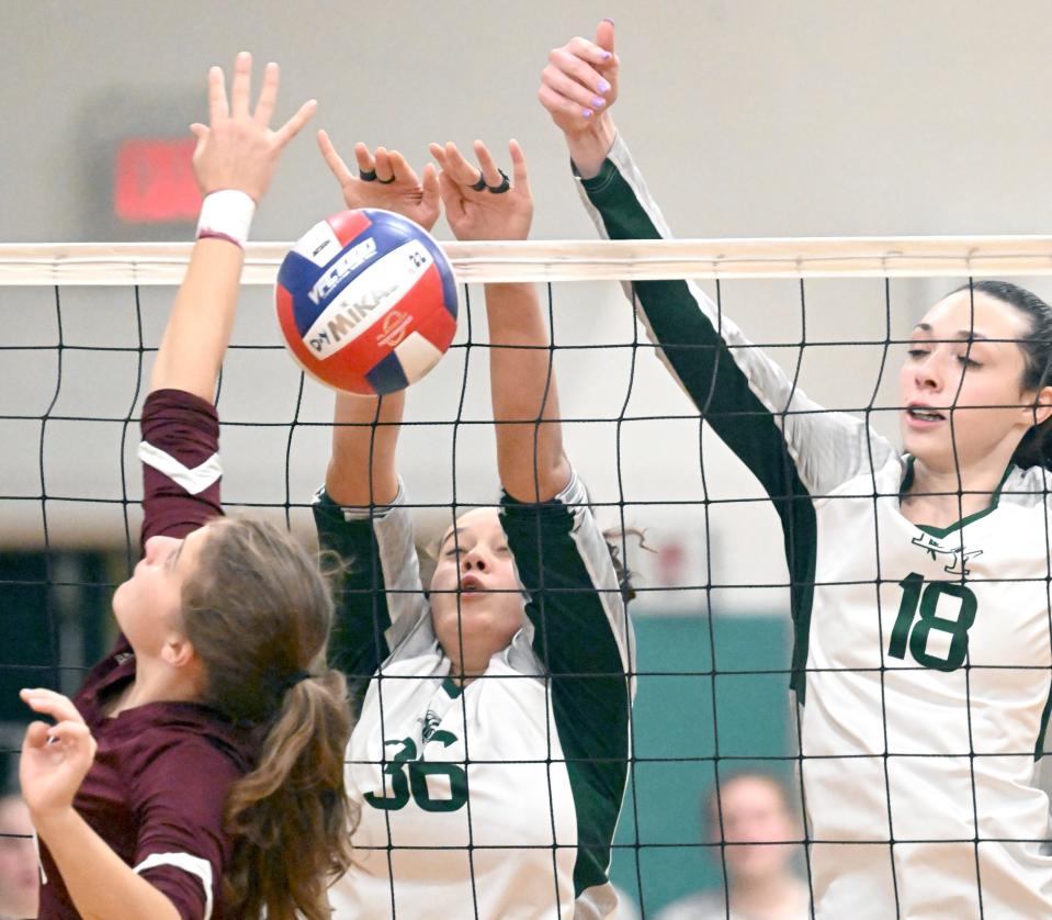 Aeva DaBreo (center) and Mariah Eaton of D-Y block the ball back at Christina Femino of Falmouth in Monday's game. For a photo gallery of more images, see https://www.capecodtimes.com/news/photo-galleries/