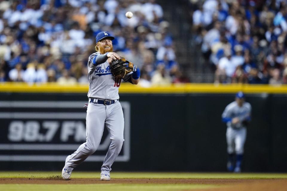 Dodgers third baseman Justin Turner makes a throwing error during the fourth inning Sept. 25, 2021.