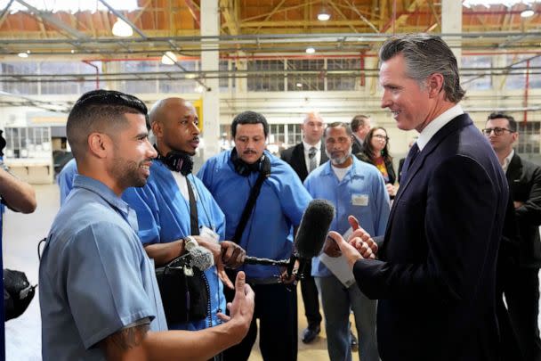 PHOTO: Incarcerated men visit with California Gov. Gavin Newsom after he spoke inside an empty warehouse at San Quentin State Prison in San Quentin, Calif., Mar. 17, 2023. (Eric Risberg/AP)