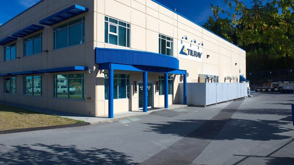 Two-story building with Tilray logo on it, next to empty parking lot.