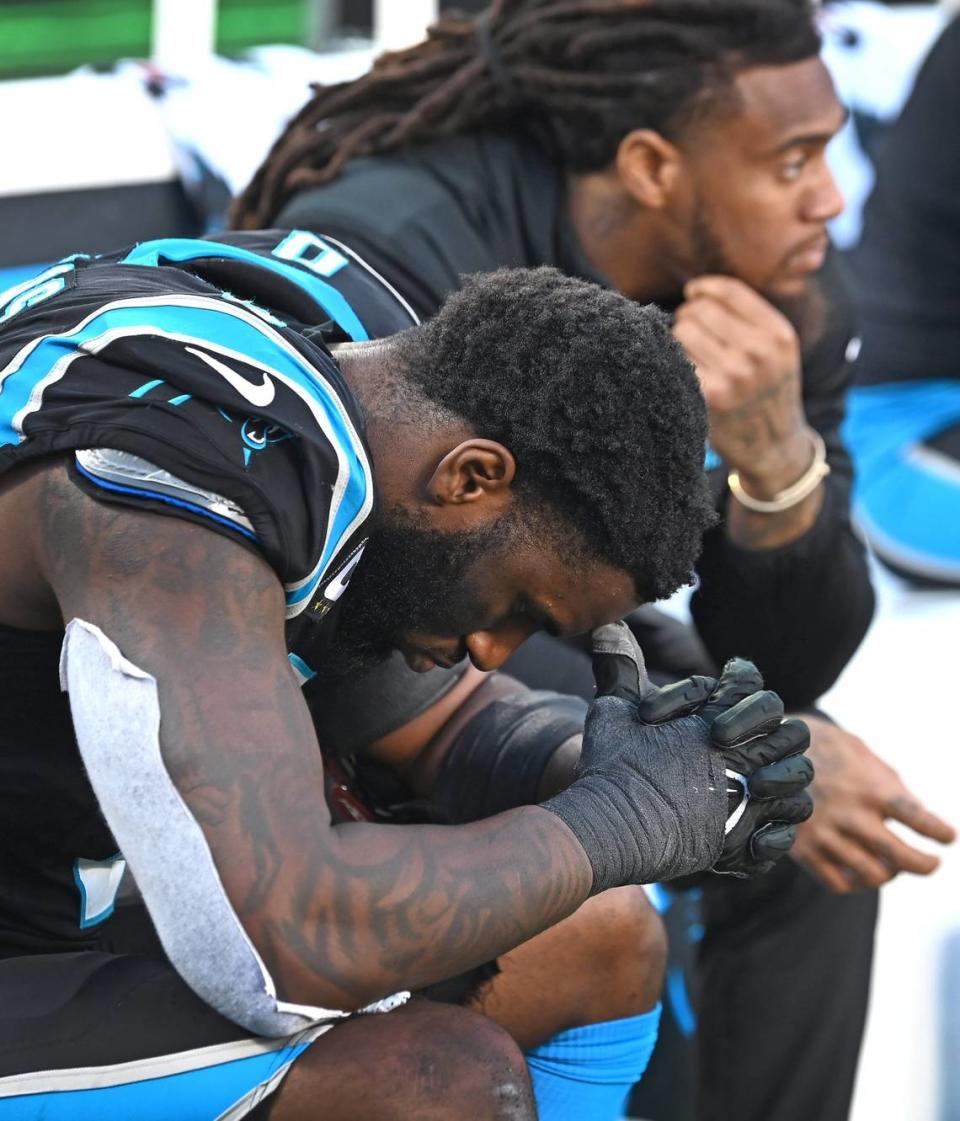 Carolina Panthers linebacker Brian Burns sits on the team’s bench with injured linebacker Shaq Thompson during second half action against the Dallas Cowboys at Bank of America Stadium in Charlotte, NC on Sunday, November 19, 2023. The Cowboys defeated the Panthers 33-10.