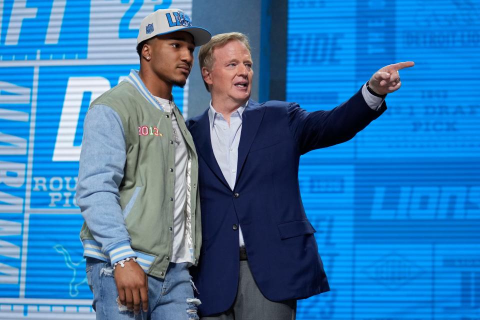 Alabama defensive back Brian Branch, left, speaks with NFL Commissioner Roger Goodell after being chosen by the Detroit Lions during the second round of the NFL football draft, Friday, April 28, 2023, in Kansas City, Mo.
