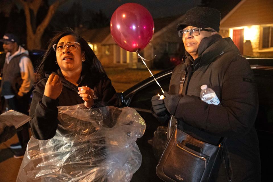 Seneca McDade (left) and her mother Debra McDade attend a memorial event on Dec. 9, 2023 honoring the life of Aundre Cross, a 44-year-old U.S. Postal Service worker who was shot and killed while delivering mail a year ago on Dec. 9, 2022 in the 5000 block of North 65th Street in Milwaukee.