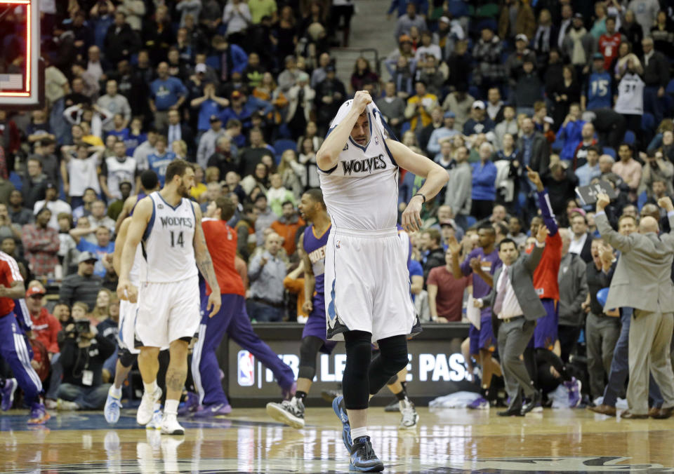 Minnesota Timberwolves' Kevin Love pulls his jersey over his head as he leaves the court after the Phoenix Suns came from behind to beat the Timberwolves 104-103 in an NBA basketball game Wednesday, Jan. 8, 2014, in Minneapolis. (AP Photo/Jim Mone)