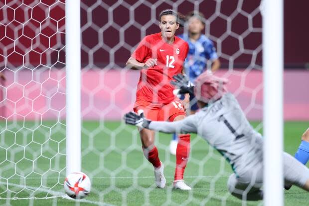 Christine Sinclair scores the first goal for Team Canada during the first-round match between Japan and Canada during the Tokyo 2020 Olympic Games at Sapporo Dome on Wednesday in Sapporo, Japan. (Masashi Hara/Getty Images - image credit)