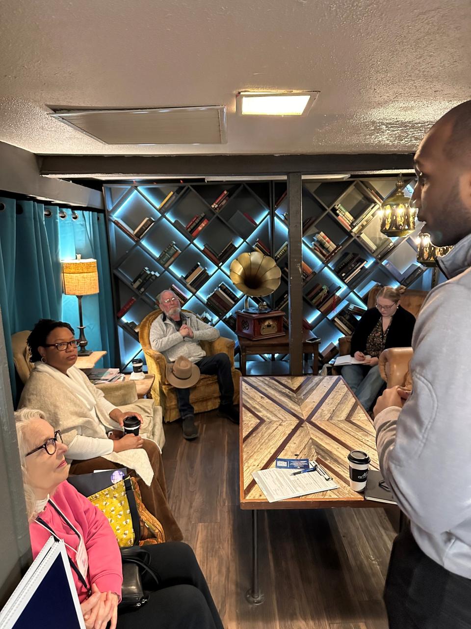 Members of the Taylor County Democratic Party listen to Thierry Tchenko outline his ideas for Texas.