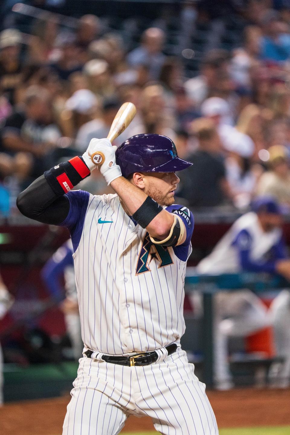 Arizona Diamondbacks catcher Carson Kelly bats in the fifth inning against the San Diego Padres at Chase Field, Aug. 11, 2023 in Phoenix.