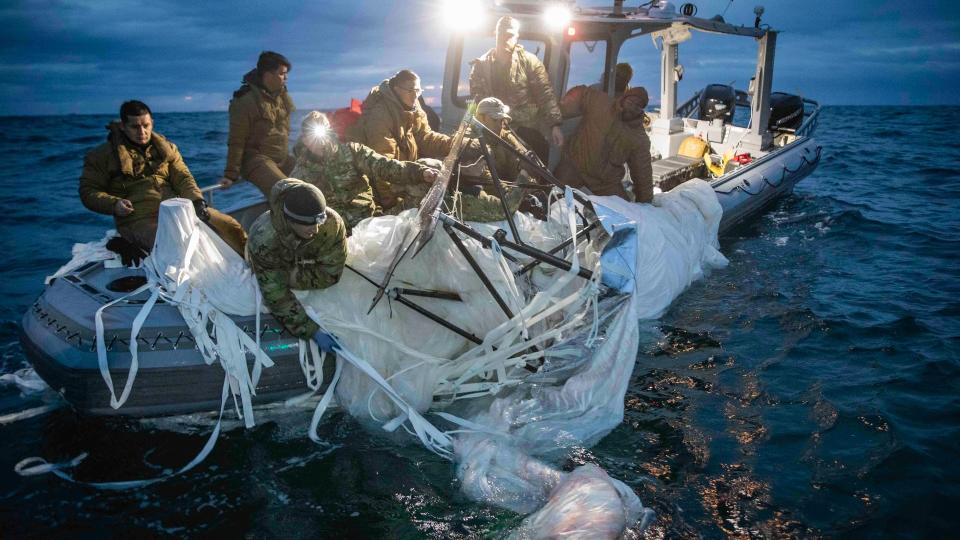 Sailors assigned to Explosive Ordnance Disposal Group 2 recover a high-altitude surveillance balloon off the coast of Myrtle Beach, South Carolina, Feb. 5, 2023.