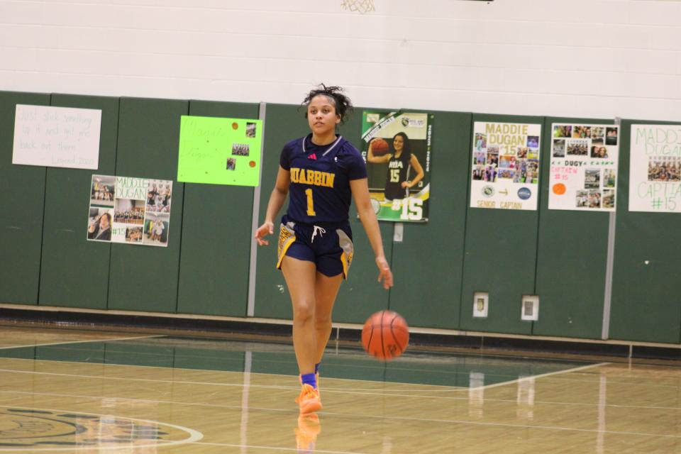 Quabbin's Mia Ducos brings the ball up the court against NDA on Feb. 6, 2024. Ducos led the Panthers to victory with 21 points.