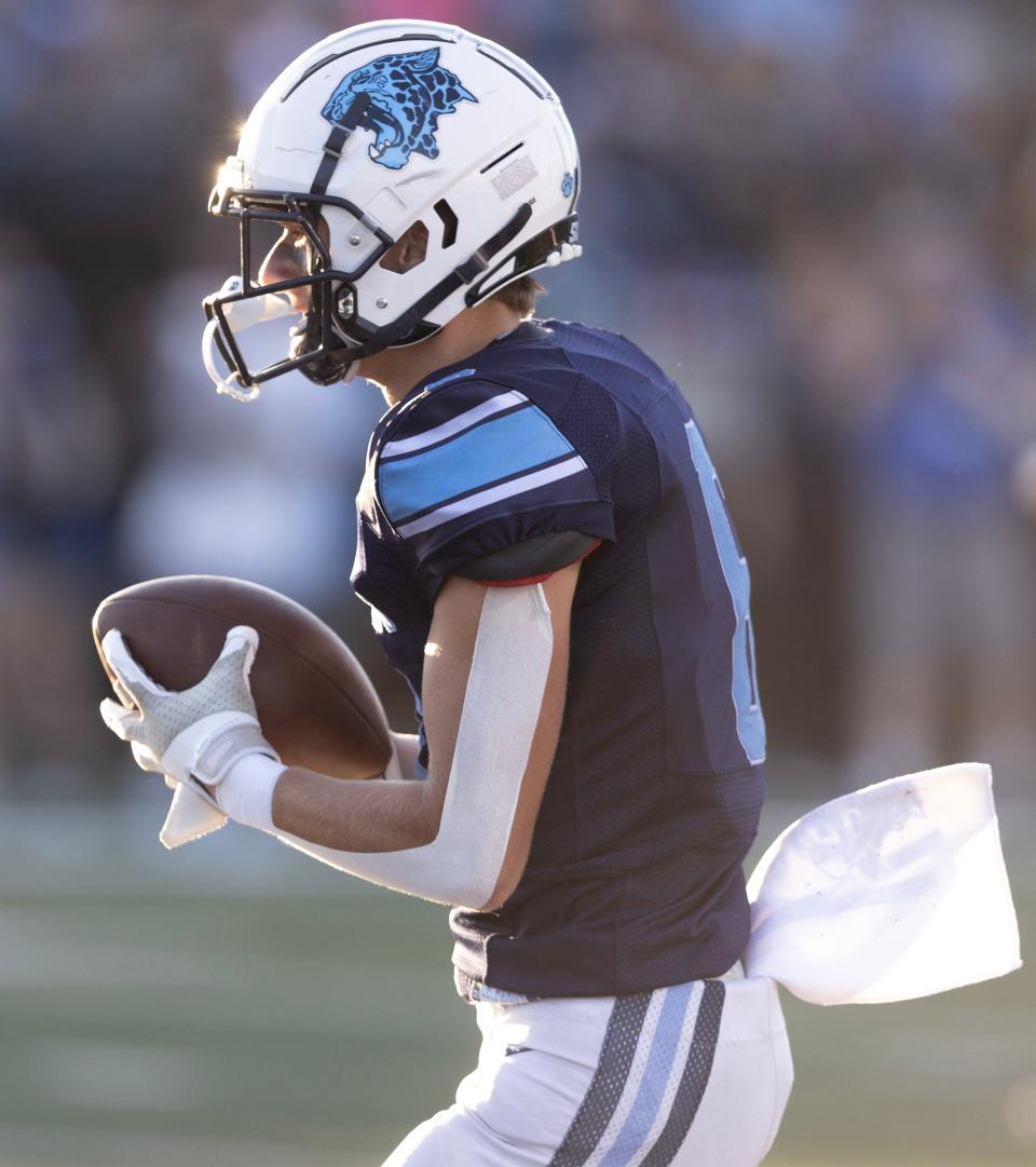 Louisville receiver Braiden Hershey runs for a first-half touchdown against Northwest, Fri., Aug. 1, 2023.