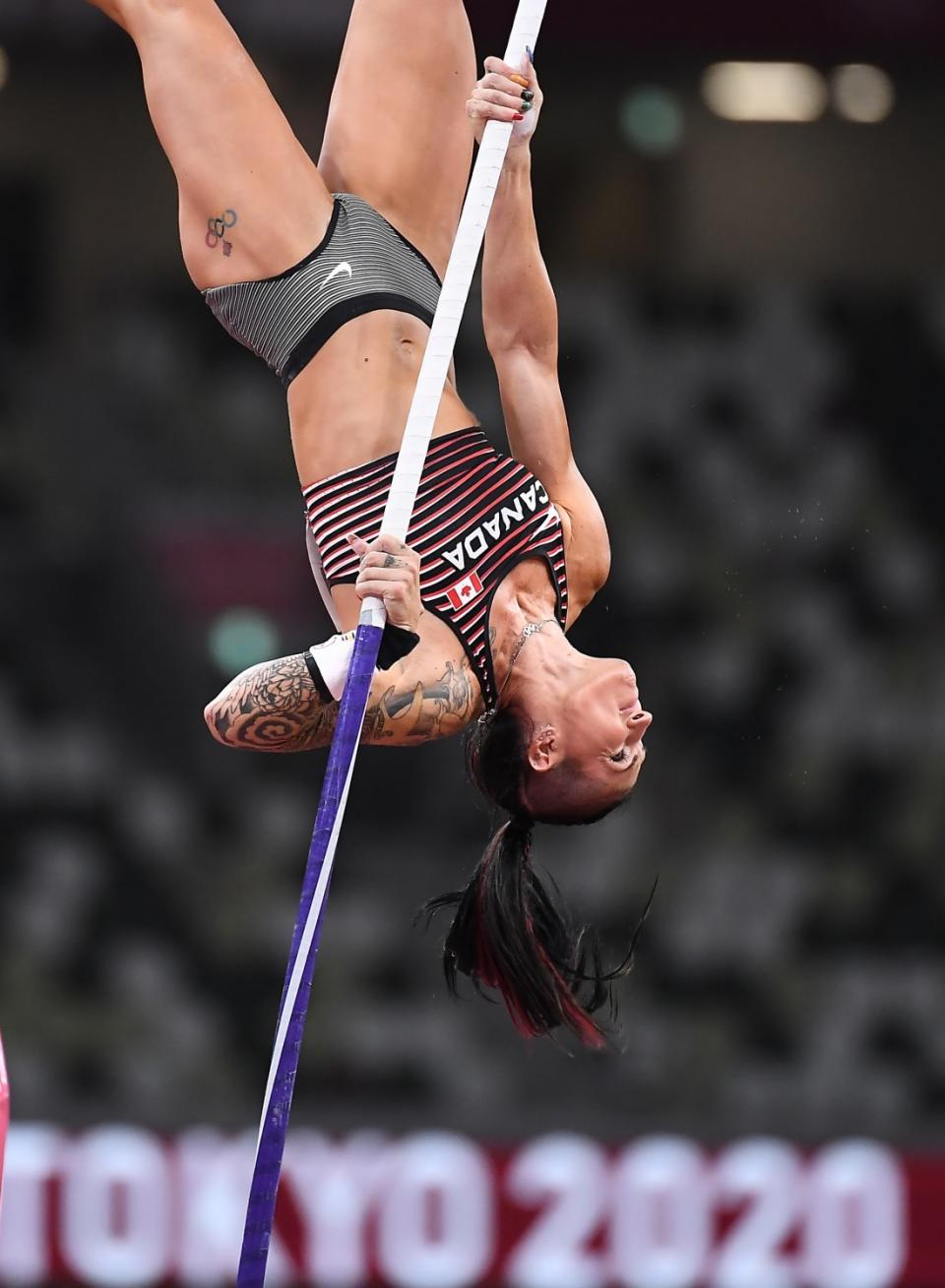 Canada's Anicka Newell competes in the women's pole vault final.