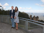 Britain's Prince William and his wife, Kate, the Duchess of Cambridge, pose in front of the Three Sisters rock formation in the Blue Mountains during a tour of Echo Point in Katoomba, Australia Thursday, April 17, 2014. The royal couple, along with Prince George, are on the 10-day official visit. (AP Photo/Rick Rycroft, Pool)