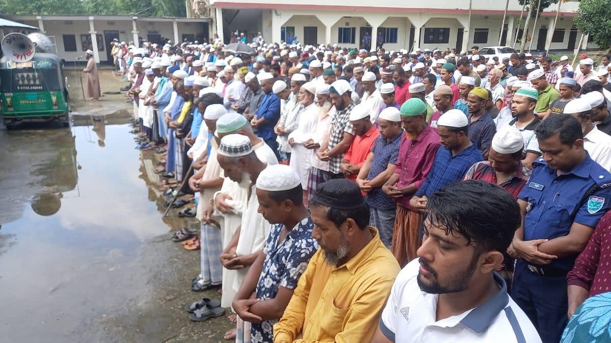 Hundreds gather to mourn the deaths of Rafiqul Islam, 51, and 16-year-old Mahiqul in Bangladesh (Family handout)