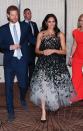 <p>Back in Sydney after a whirlwind day in Tonga, Harry and Meghan changed into formal attire for an elegant evening at the Australian Geographic Society Awards. The Duchess <a href="https://www.townandcountrymag.com/style/fashion-trends/a24230198/meghan-markle-oscar-de-la-renta-gown-sydney-australia-royal-tour/" rel="nofollow noopener" target="_blank" data-ylk="slk:wore a black and white gown;elm:context_link;itc:0;sec:content-canvas" class="link ">wore a black and white gown</a> by Oscar de la Renta for the night. </p>