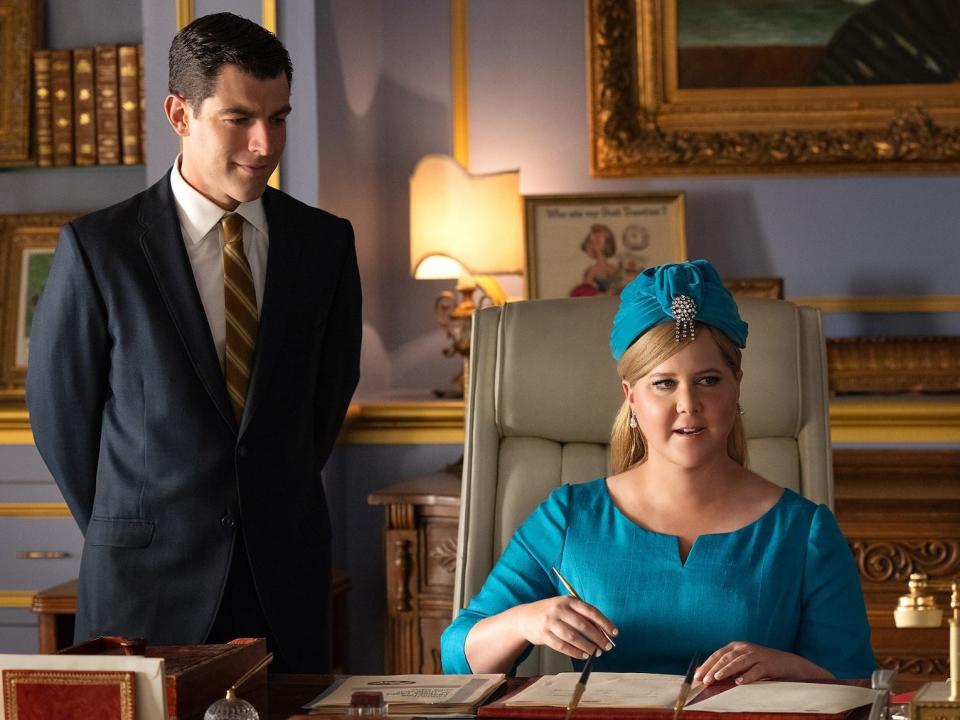Max Greenfield as Rick Ludwin and Amy Schumer as Marjorie Post in "Unfrosted."