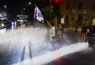 Protest in Jerusalem after the police chief quit, citing government meddling against anti-government protesters