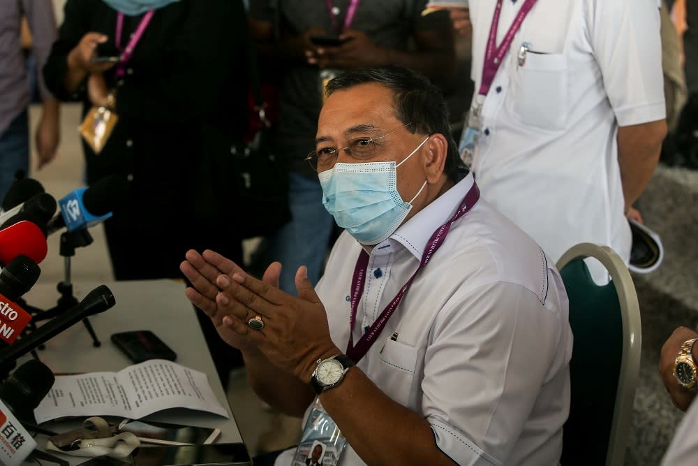 Election Commission chairman Datuk Abdul Ghani Salleh speaks to reporters at the Sekolah Kebangsaan Aminnudin Baki polling station in Slim River August 29, 2020. ― Picture by Farhan Najib