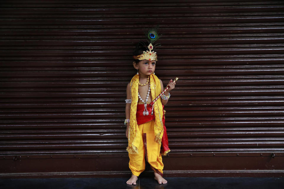 <p>A boy dressed as Hindu Lord Krishna participates in the Janmashtami festivities in Mumbai, India, Aug. 25, 2016. Janmashtami marks the birth of Lord Krishna. (Photo: Rafiq Maqbool/AP) </p>