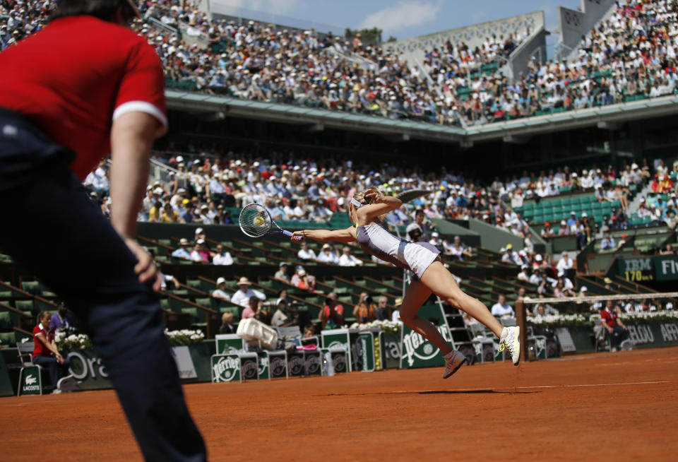 FILE - In this June 5, 2013, file photo, Russia's Maria Sharapova returns the ball to Serbia's Jelena Jankovic during their quarterfinal match of the French Open tennis tournament at Roland Garros stadium in Paris. (AP Photo/Petr David Josek, File)