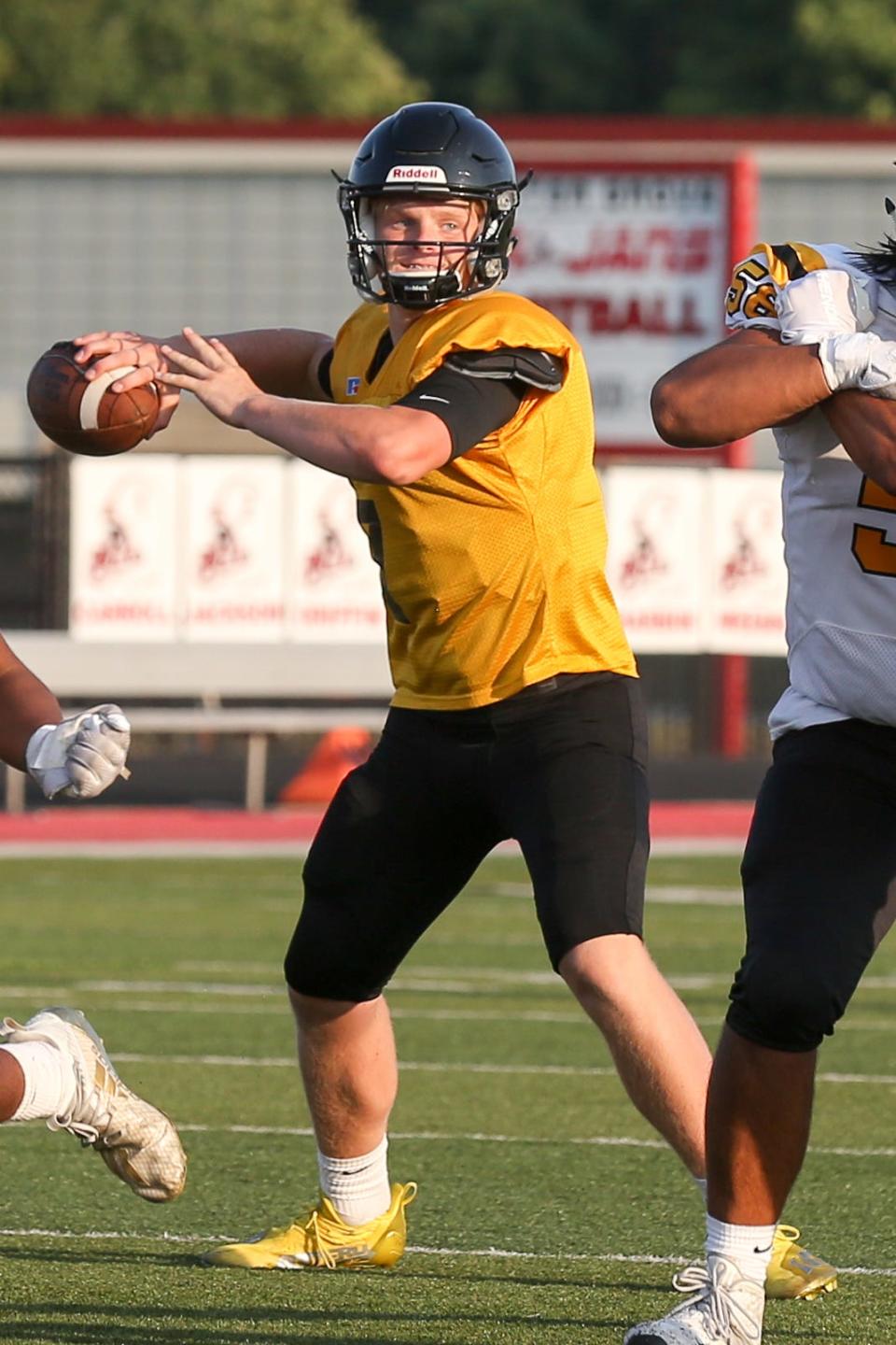 Avon's Mason Reynolds (7) looking for an open man during the pre-season high school football scrimmage as Center Grove takes on Avon at Center Grove High School in Greenwood, Indiana on Friday, August 13, 2021.