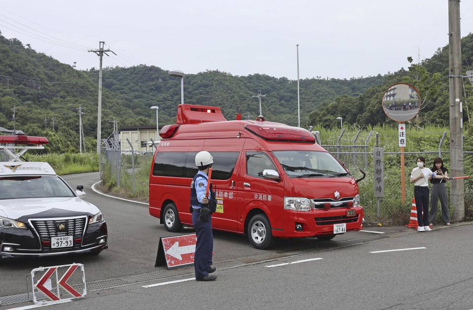 A fire truck leaves a base firing range of Ground Self Defence Force, following a deadly shooting in Gifu, central Japan, Wednesday, June 14, 2023. A Japanese soldier was arrested Wednesday after allegedly shooting three colleagues at the base in central Japan, officials said. (Kyodo News via AP)