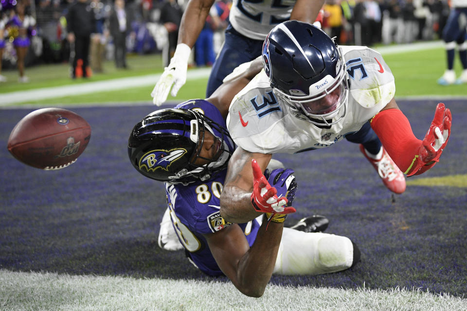 Baltimore Ravens wide receiver Miles Boykin (80) misses the catch on a two-point conversion against Tennessee Titans free safety Kevin Byard (31) during the second half of an NFL divisional playoff football game, Saturday, Jan. 11, 2020, in Baltimore. (AP Photo/Nick Wass)