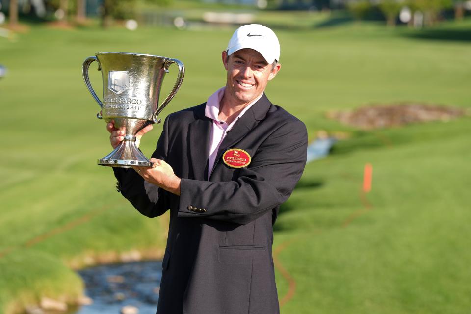 May 12: Rory McIlroy celebrates with the winner's trophy after the final round of the Wells Fargo Championship at Quail Hollow Golf & Country Club in Charlotte, N.C.