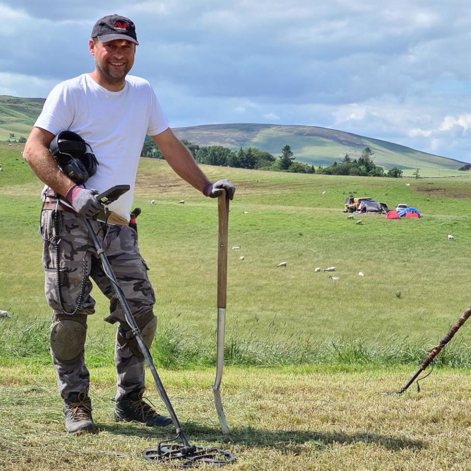 Metal detectorist Mariusz Stepien at the excavation site near Peebles.