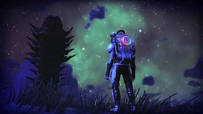 An astronaut standing on a dark planet's surface looking at the stars in video game No Man's Sky