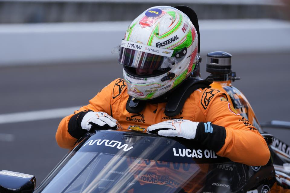 Pato O'Ward, of Mexico, climbs out of his car during qualifications for the Indianapolis 500 auto race at Indianapolis Motor Speedway, Sunday, May 19, 2024, in Indianapolis. (AP Photo/Darron Cummings)