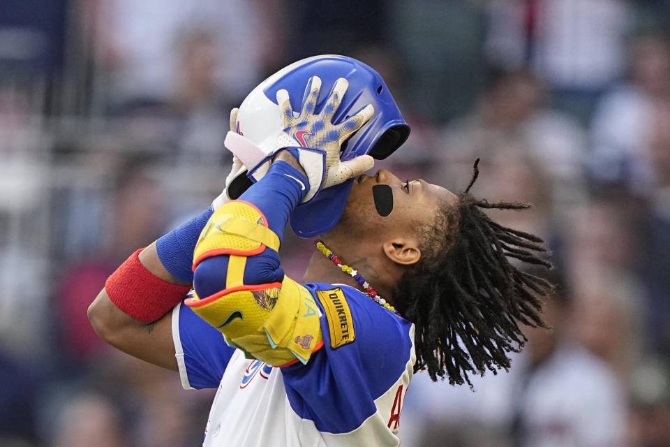 Atlanta Braves right fielder Ronald Acuna Jr. (13) puts on a helmet in the first inning of a baseball game against the Pittsburgh Pirates, Saturday, Sept. 9, 2023, in Atlanta. (AP Photo/Brynn Anderson)