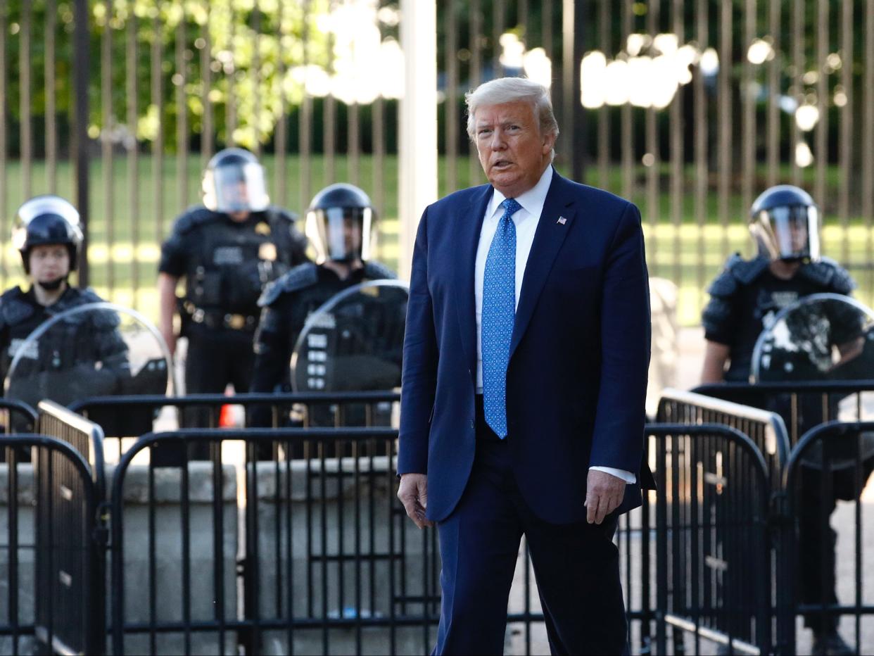 President Donald Trump walks in Lafayette Park to visit outside St. John's Church across from the White House Monday, June 1, 2020, in Washington. Part of the church was set on fire during protests on Sunday night. (AP Photo/Patrick Semansky)