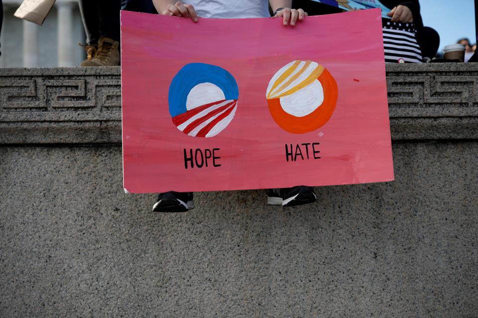 <p>A demonstrator holds a sign during the second annual Women’s March in Washington, Jan. 20, 2018. (Photo: Aaron Bernstein/Reuters) </p>